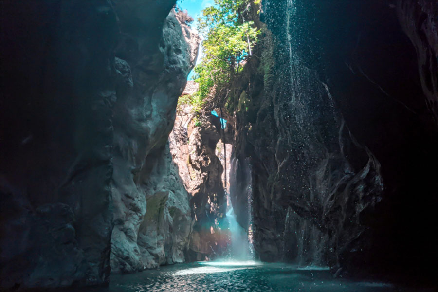 water in a ravine where light enters 