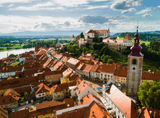view of the city with the towering church tower