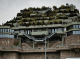 multi-storey building covered with vegetation