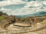 ruins of an old building surrounded by mountains