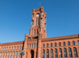 long red brick building with a clock tower