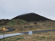 view of the volcano from the asphalt road leading to it