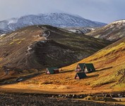 a small settlement in the mountains shimmering with colours