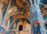 the vault and pillars inside the church, all covered with paintings