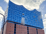 tall building, wave-shaped roof