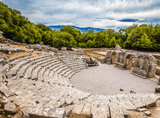 stone seats in a semi-circle in front of the stone stage