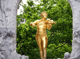 gold sculpture of a violinist