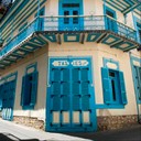 tenement house with blue doors and windows