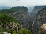 high mountains with a river between them