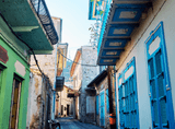 tenement house with blue doors and windows