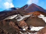 view of a mountain with steam rising from it